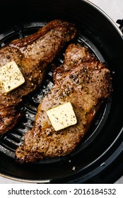 Closeup Of Air Fryer Steaks With Butter