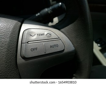 Close-up Of Airconditioning Controller Panel On Car Steering Wheel. Focus On Center Area. Others In Gradient Blur.  