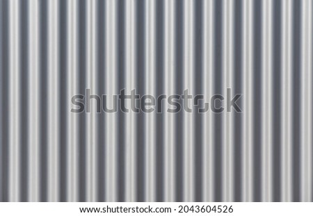 Close-up of an aluminium wall made of corrugated sheet metal on a warehouse.