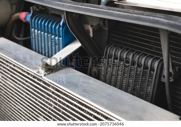 Close-up of Aluminum Engine Oil Cooler\
installed behind an\
intercooler.