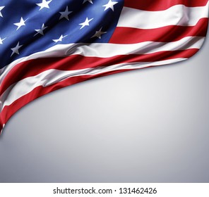 Closeup of American flag on plain background