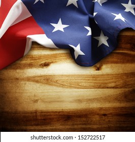 Closeup Of American Flag On Wood Background