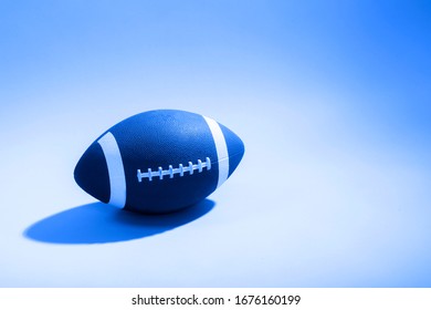 Close-Up Of American Football Ball. Blue filter - Powered by Shutterstock