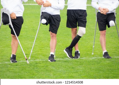 close-up of ampute soccer player and team friends - Powered by Shutterstock