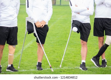 close-up of ampute soccer player and team friends - Powered by Shutterstock