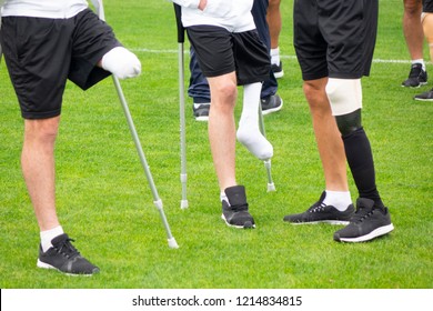 close-up of ampute soccer player and team friends - Powered by Shutterstock