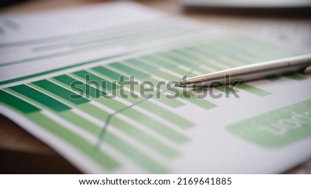 Close-up of analytics and business statics documents or development plan. Financial report, statistics data with chart and graph concept