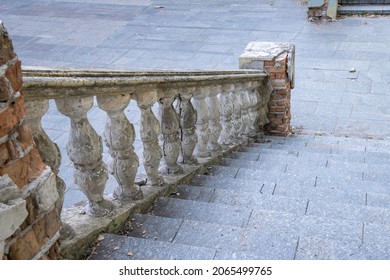 Close-up Ancient Stone Railings. Old Classic Balustrade. Disrupted Stairs. Details Of The Architecture.