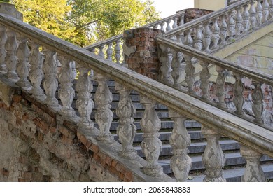 Close-up Ancient Stone Railings. Old Classic Balustrade. Disrupted Stairs. Details Of The Architecture.