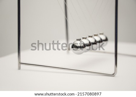 A close-up angle shot of the Newton's cradle 
