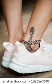 Closeup Of Ankle Tattoo Of A Woman