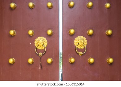 closeup of the antique oriental door knocker