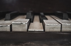 Closeup Of Antique Piano Keys And Wood Grain With Drak Tone