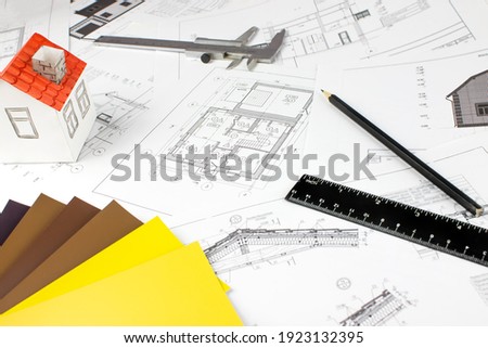 Close-up of Architect engineer drawing plan with architect equipment. Paper architectural drawings and blueprint. Interior Design