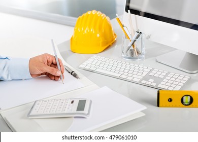 Architect Hands Working On Blueprint Plans Stock Photo (Edit Now