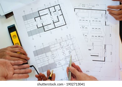 Close-up, architects team are brainstorming, designing and drawing the structure of the building.