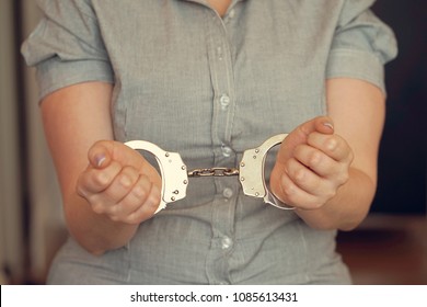 Close-up. Arrested Woman Handcuffed Hands. Prisoner Or Arrested Terrorist, Close-up Of Hands In Handcuffs, Selective Focus. Toning