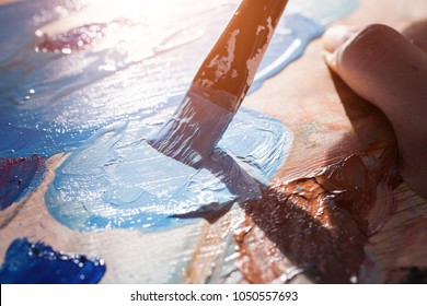 Close-up of artist's brush and palette - Powered by Shutterstock