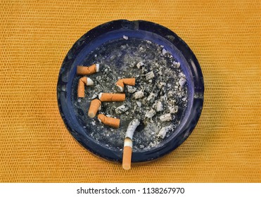 Closeup Of An Ashtray Full Of Cigarettes Viewed From Above