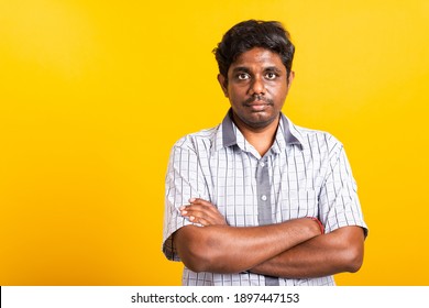 Closeup Asian Happy Portrait Young Black Man Standing Cross Arms Chest Confident Pose And Looking Camera, Studio Shot Isolated On Yellow Background