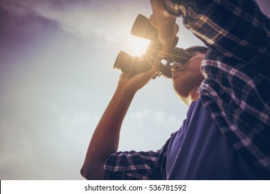 Close-up Of Asian man Hand Holding / looking / watching using Binoculars with copyspace, Technology Binoculars background concept - Shutterstock ID 536781592