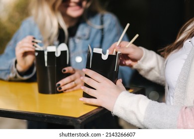 Close-up Of Asian Takeaway Food. Best Friends Spend Time Together In Pring Sunny Day. Outdoors