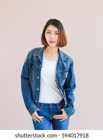 Closeup Asian Woman Casual Outfits Standing In Jeans And Blue Denim Shirt, Women Brown Hair And Short Hair, Smiling And Wearing Jeans Jacket, Beauty And Fashion Concept, Jeans Concept