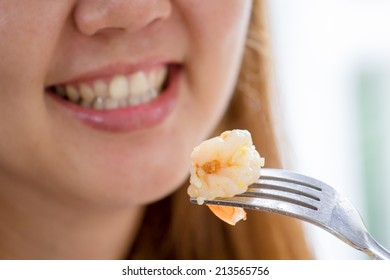 Close-up Of Asian Woman Eating Fresh Shrimp