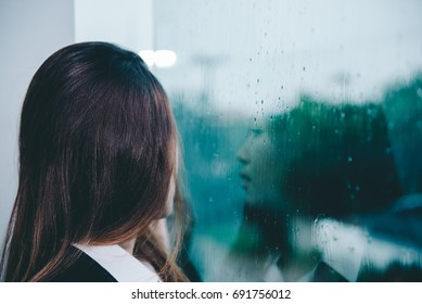 Closeup Asian Woman Sad From Love At Mirror With Reflection In A Raining Day Vintage Style,heartbreak Woman Concept,stress Girl