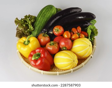 Close-up of assorted fresh vegetables like tomatoes, cherry tomatoes, melon, bell pepper, eggplant, pumpkin and lettuce on bamboo basket, South Korea
 - Powered by Shutterstock