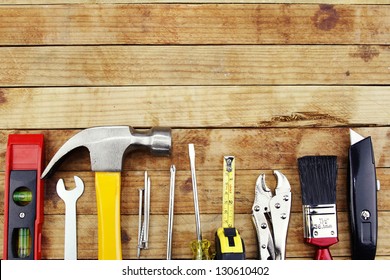 Closeup of assorted work tools on wood - Powered by Shutterstock