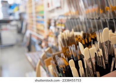 Close-up. Assortment of paintbrushes with synthetic and natural bristles, of different softness displayed for sale in the school stationery store. Creative hobby. Art shop. Fine art. Painting concept - Powered by Shutterstock