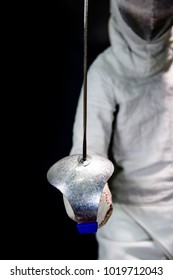 Close-up Of Athlete Man Fencing Sabre Holding Sword And Wearing Fencing Suit Prepare To Fight On Black Background