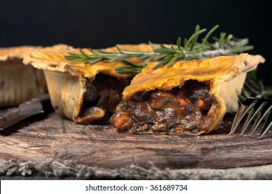 Closeup Australian Meat Pie On The Wooden Table With Copy Space, Rustic Style