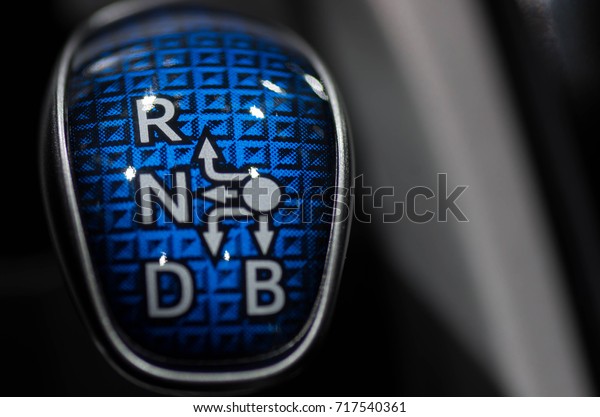 Closeup of\
an automatic gear stick of an electric\
car