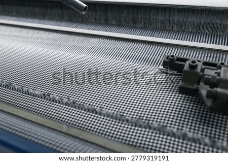Close-up of an automatic loom without people. Textile Production Line