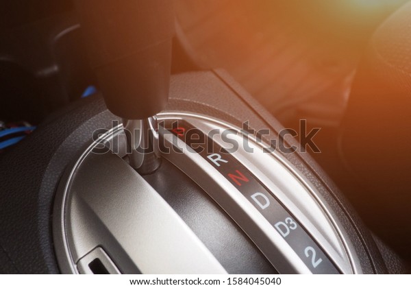 Closeup of automatic transmission\
in the car for modern design and interior. Gear stick and car\
equipment and transportation for safety driving\
concept