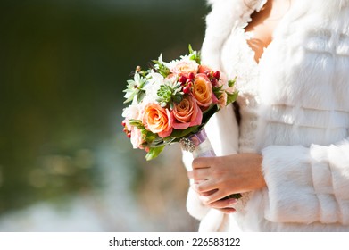 Closeup Of An Autumn Wedding Bouquet In Bride's Hands