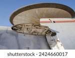 Closeup of an AWACS plane with folded wing