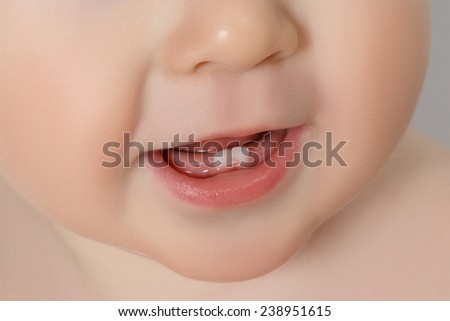 close-up Baby mouth with two rises teeth