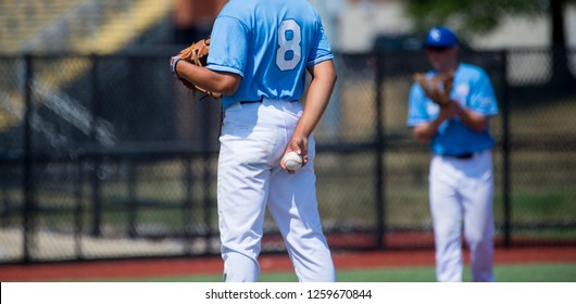 Closeup From The Back Of Baseball Player In Blue Jersey 