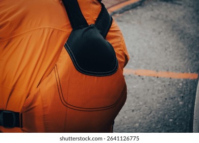 close-up of the back of a person wearing a paddling personal floatation device. sports kayaking aquatic design element