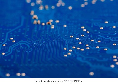 Closeup of back side of a blue electrical board