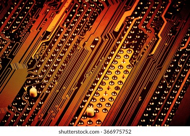 Close-up of back side circuit board pattern with pins in rows. Shallow DOF. Filtered toned image.