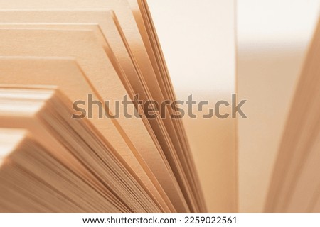 Closeup background of book with opened pages. Selective focus.Very narrow depth of field.