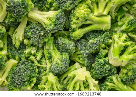 closeup background of frozen broccoli florets, healthy eating concept