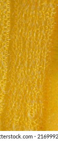 closeup, background, texture, large long vertical banner. heterogeneous surface structure bright saturated yellow sponge for washing dishes, kitchen, bath. full depth of field. high resolution photo - Shutterstock ID 2169992673