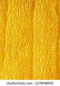 closeup, background, texture, large long vertical banner. heterogeneous surface structure bright saturated yellow sponge for washing dishes, kitchen, bath. full depth of field. high resolution photo - Shutterstock ID 2178948935