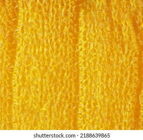 closeup, background, texture, large long vertical banner. heterogeneous surface structure bright saturated yellow sponge for washing dishes, kitchen, bath. full depth of field. high resolution photo - Shutterstock ID 2188639865