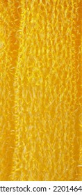 closeup, background, texture, large long vertical banner. heterogeneous surface structure bright saturated yellow sponge for washing dishes, kitchen, bath. full depth of field. high resolution photo - Shutterstock ID 2201464869